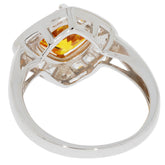 Elegant silver ring showcasing a yellow gemstone, highlighting intricate details and craftsmanship.